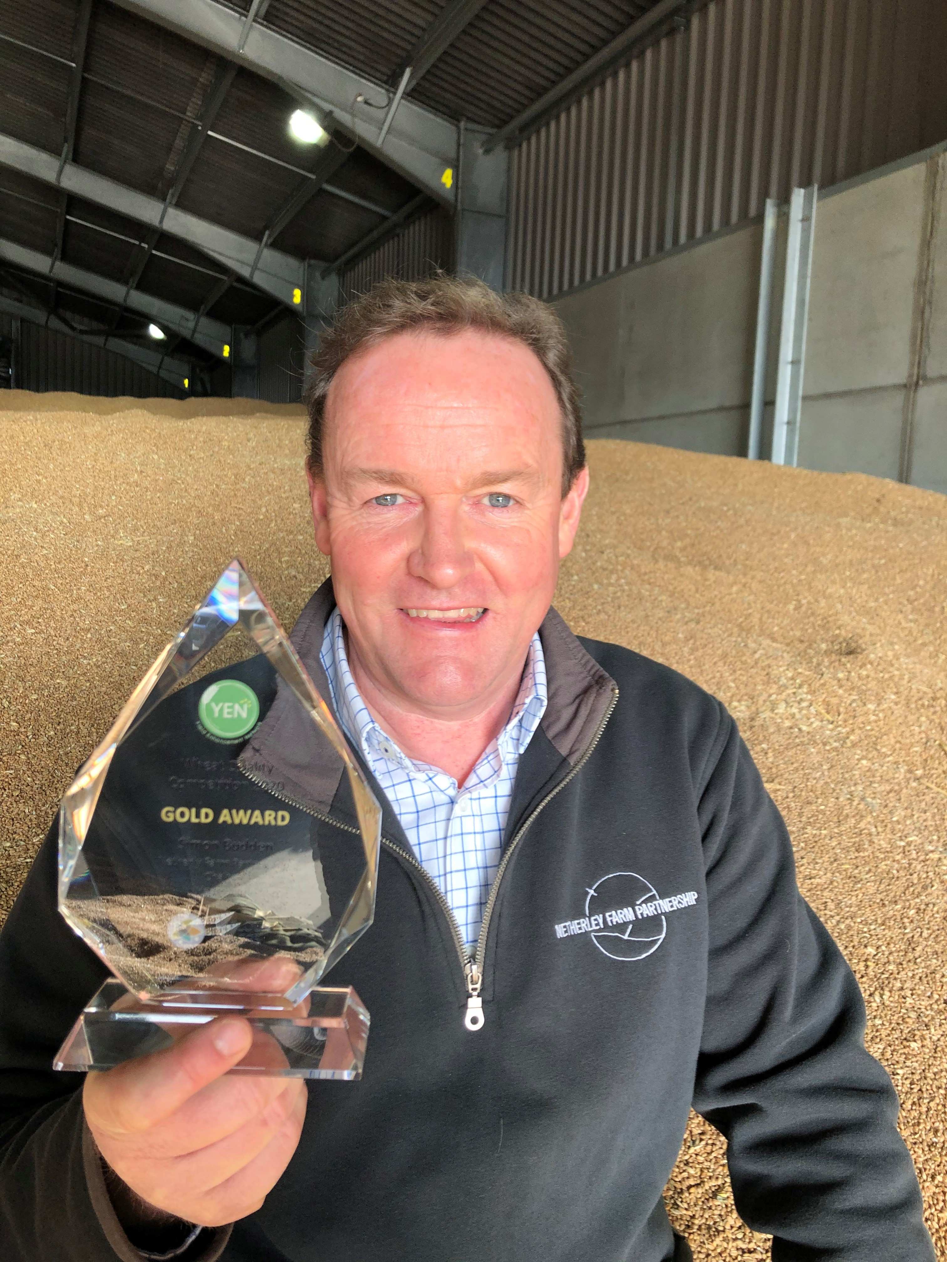 Bob Munden holding a trophy
